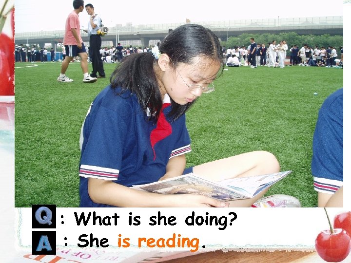 : What is she doing? : She is reading. 