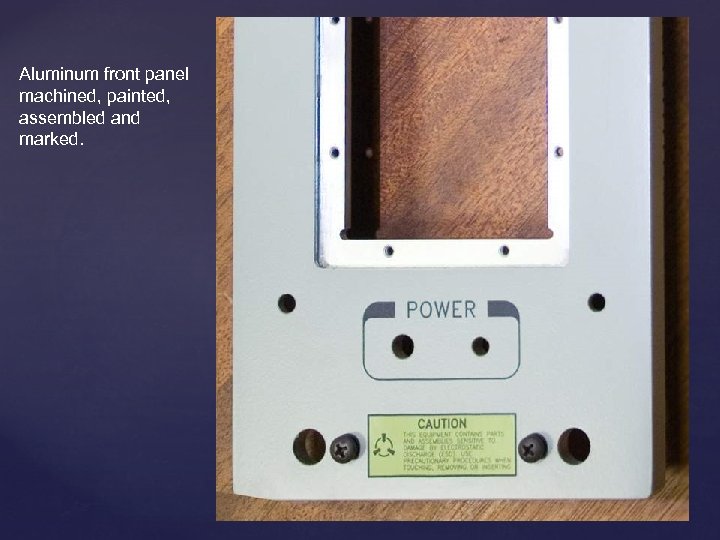 Aluminum front panel machined, painted, assembled and marked. 