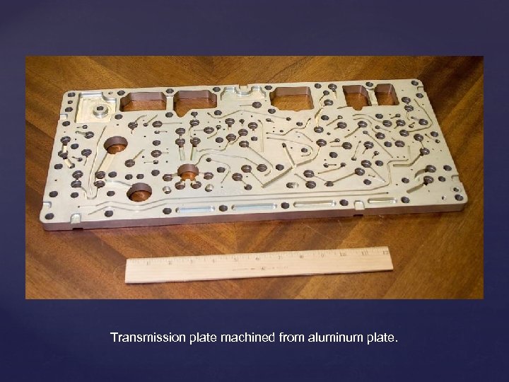 Transmission plate machined from aluminum plate. 