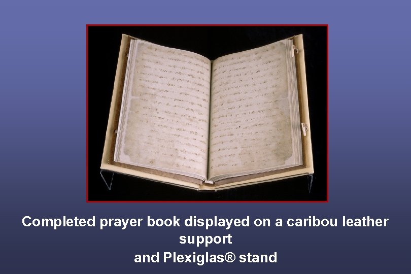 Completed prayer book displayed on a caribou leather support and Plexiglas® stand 